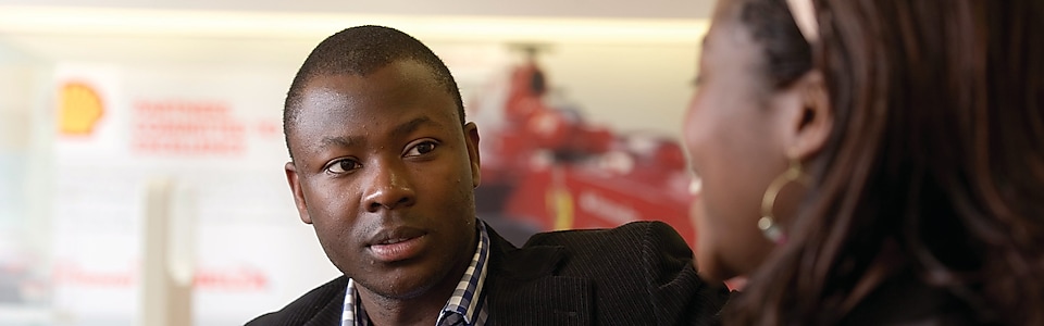 African male in conversation
